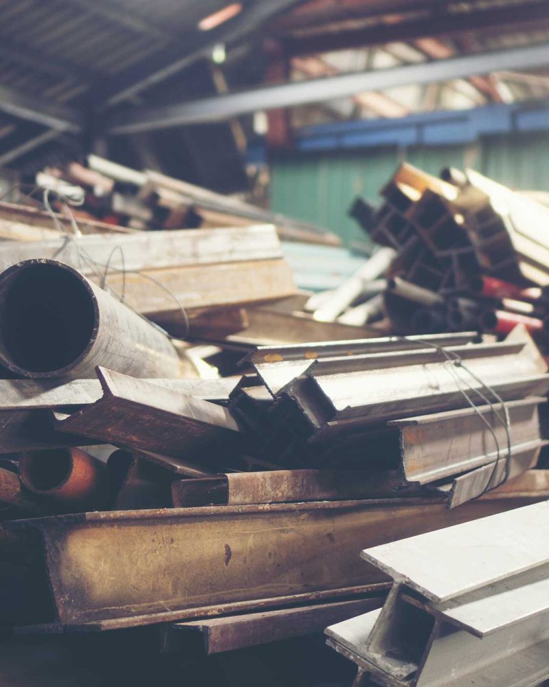 stack-of-steel-pipes-in-metal-factory-shop